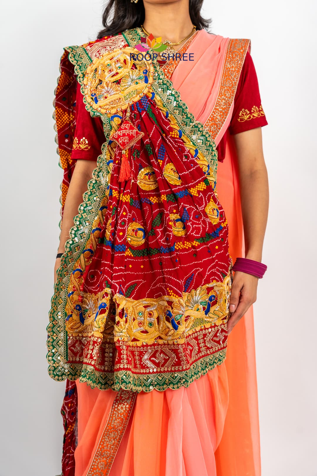 Elegant odhna with one-side brooch featuring Swastik Belbuti work.