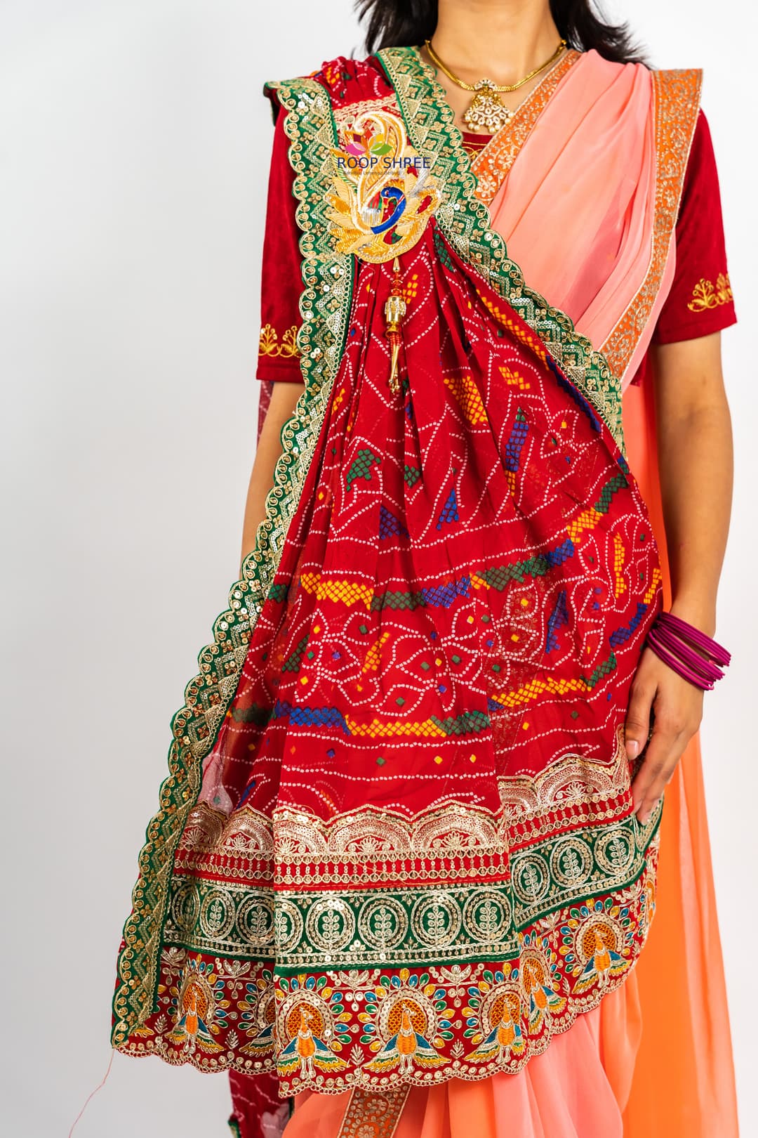 One side adorned with Peacock buta brooch,